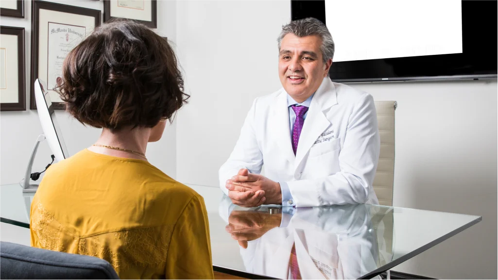 Dr. Arjang Yazdani consulting with a patient